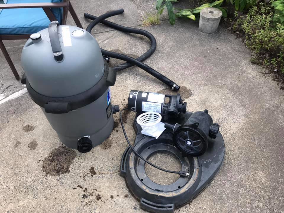 Pool pump and filter components laid out for repair or maintenance by Advanced Pools and Repair, LLC in Bristol, CT.
