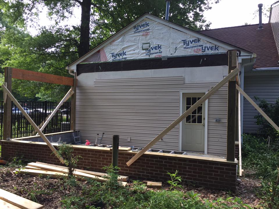 Initial framing and brick foundation for a porch addition, a handyman project by Mason Home Improvement Inc. in Newport News, VA.