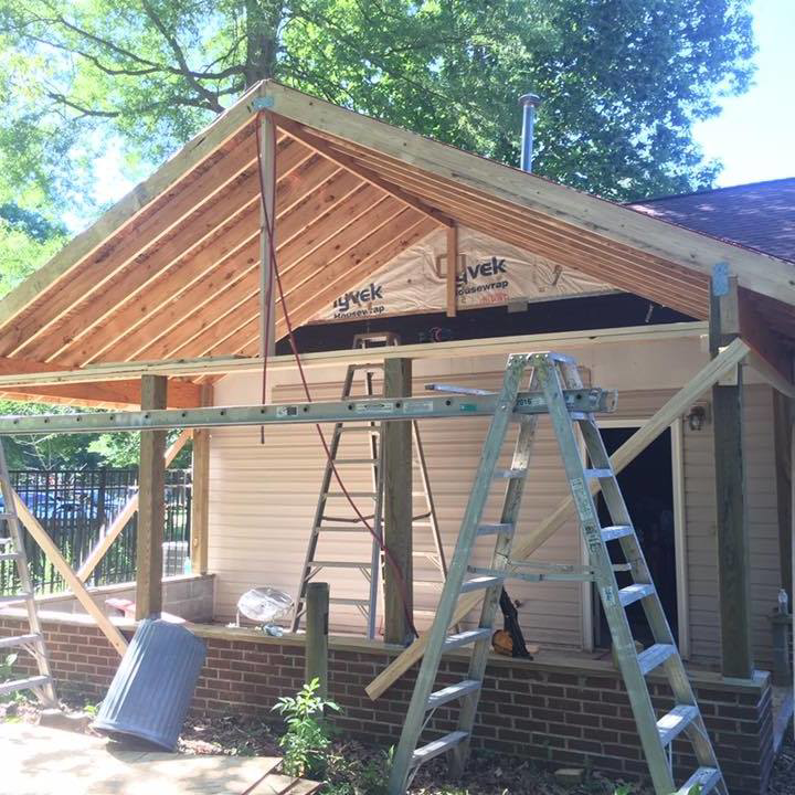 A new porch addition under construction with roof framing and siding by Mason Home Improvement Inc. in Newport News, VA.