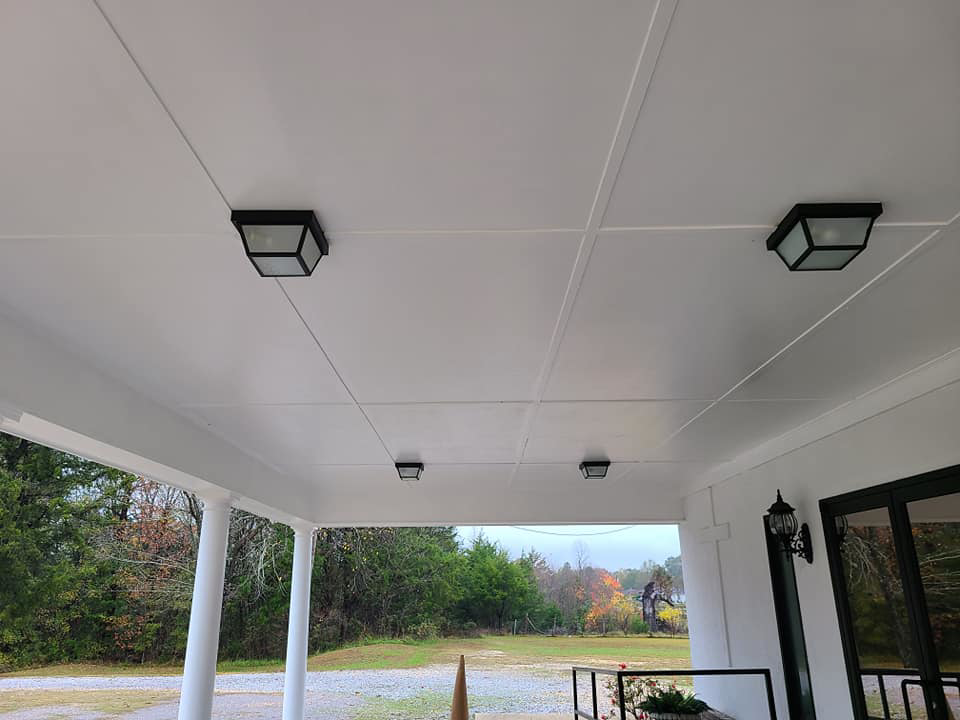 New square light fixtures installed on a white porch ceiling by K. MCGHEE CONSTRUCTION LLC in Montgomery, AL.