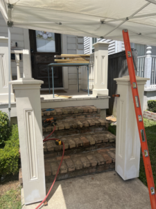 Porch stair and railing renovation in progress, showcasing exterior handyman services by Ayres Endeavors, LLC in New Orleans, LA.