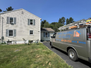 A power washing van parked at a residential house, ready for service by Corriveau Home Improvement LLC in Bristol, CT.