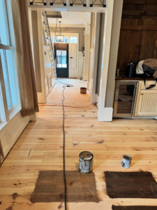 Preparing hardwood floors for staining with materials on site by Trades by Taylor LLC in Huntsville, AL.