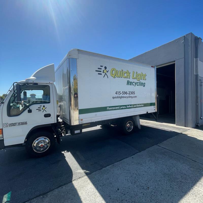A Quick Light Recycling truck parked at a facility, ready for junk removal services in South San Francisco, CA.