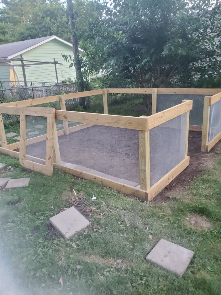 Raised garden bed construction in a backyard by Justin-case Repairs in Ankeny, IA.