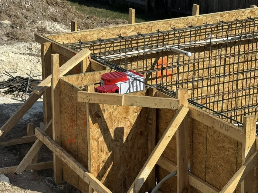 Rebar and wooden formwork for a concrete structure under construction by Stealth Civil Contracting in Austin, TX.