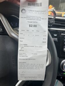 A receipt showing payment for aluminum cans recycled at Great Northwest Recycling in San Antonio, TX
