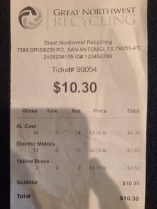 A receipt showing payment for various metals like AL cast, electric motors, and yellow brass recycled at Great Northwest Recycling in San Antonio, TX