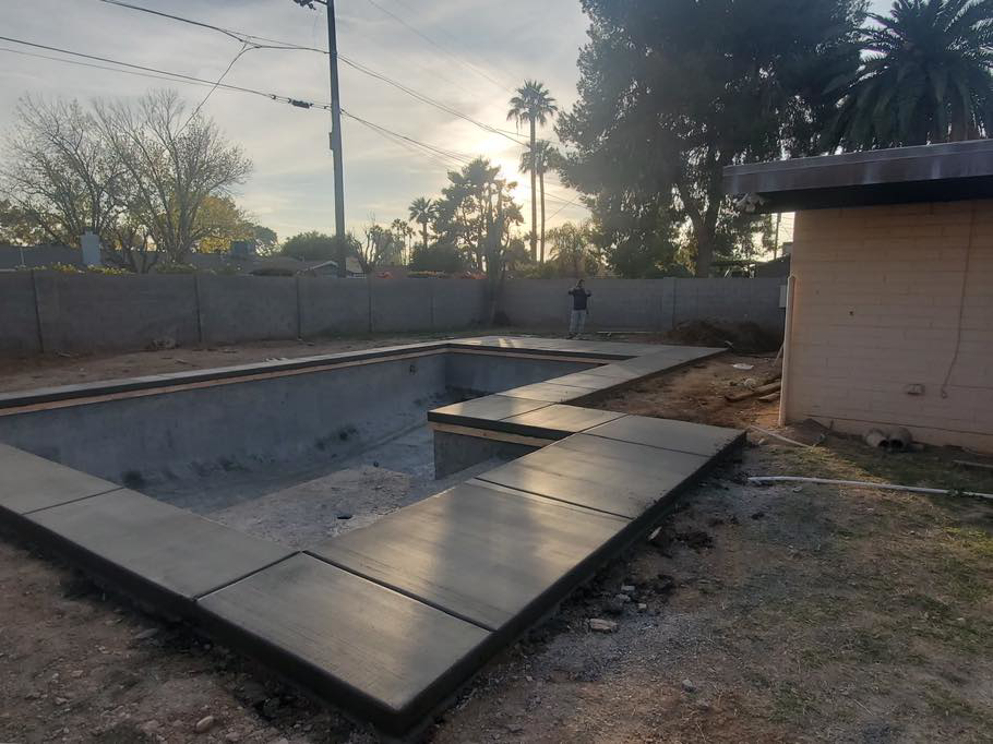 Concrete pool deck installation around a rectangular pool by Martin Jr's concrete in Surprise, AZ