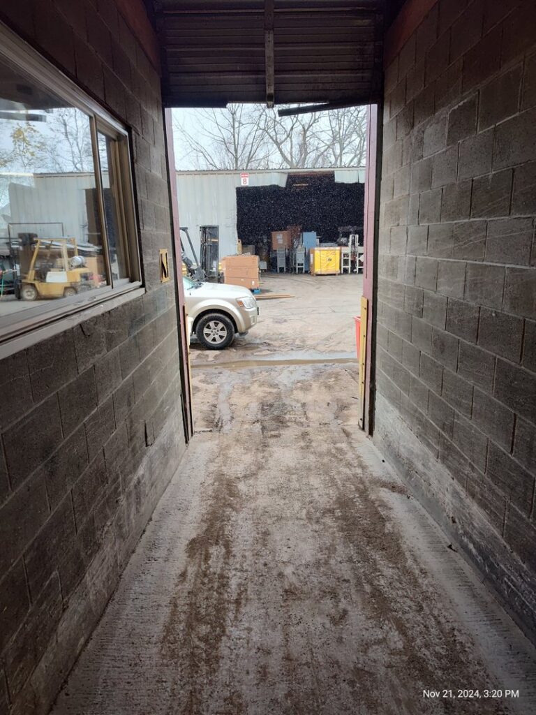 A view of the busy recycling center yard with vehicles and materials at David Hirschberg Steel & Recycling Center in Cincinnati, OH.