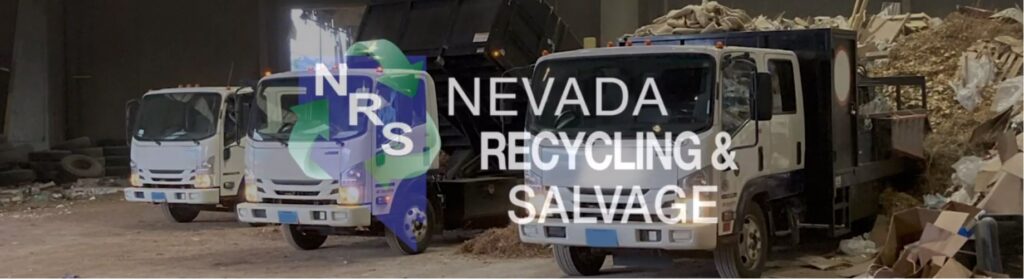 Recycling and salvage trucks parked inside the facility of Nevada Recycling and Salvage in Reno, NV.
