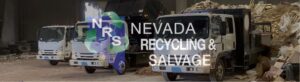 Recycling and salvage trucks parked inside the facility of Nevada Recycling and Salvage in Reno, NV.
