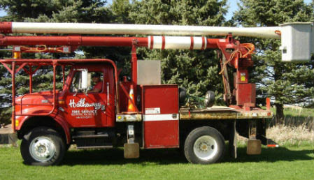 A red bucket truck from Hathaway Tree Service, used for tree removal and brush dump services in Rochester, MN