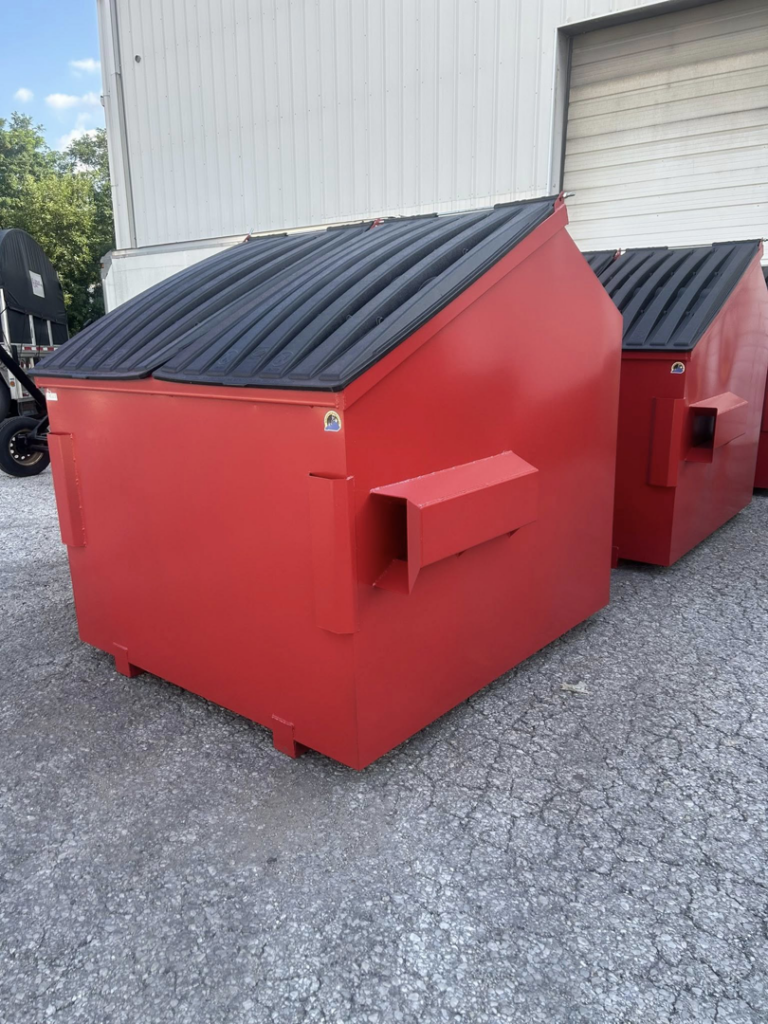 A bright red commercial dumpster with a sloped lid from Eagle Industrial Solutions in Louisville, KY.