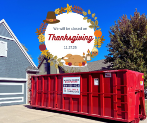 A red dumpster from Women Owned Dumpsters placed in a residential driveway in Lees Summit, MO, for junk removal projects.