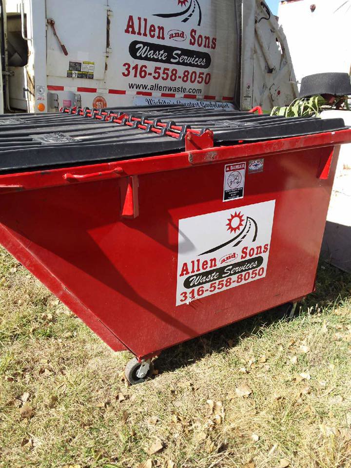 A red roll-off dumpster with the Allen and Sons Waste Services logo, ready for junk removal in Wichita, KS.