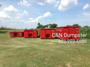 Several red dumpsters of various sizes available from C&N Dumpster in Louisville, KY