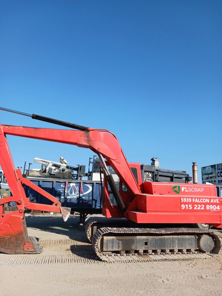 A red excavator with the FL Scrap logo and contact information, used for general junk removal services in El Paso, TX.