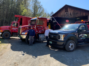 The Reed & Sons Rubbish team with their fleet of junk removal trucks, ready for service in Guilford, VT.