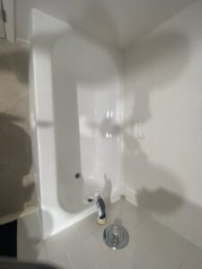 A newly refinished white bathtub and shower area by Bath Refinishing Solutions Dayton in Dayton, OH