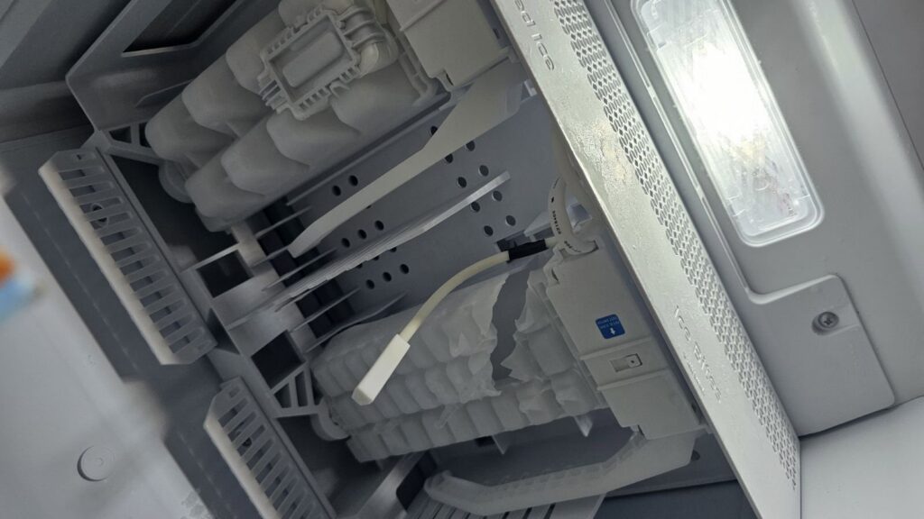 An ice maker compartment inside a refrigerator being serviced by Medina's Handyman LLC in Las Vegas, NV