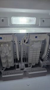 An ice maker compartment inside a refrigerator being serviced by Medina's Handyman LLC in Las Vegas, NV