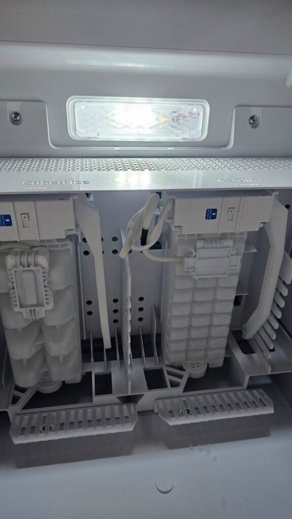 An ice maker compartment inside a refrigerator being serviced by Medina's Handyman LLC in Las Vegas, NV