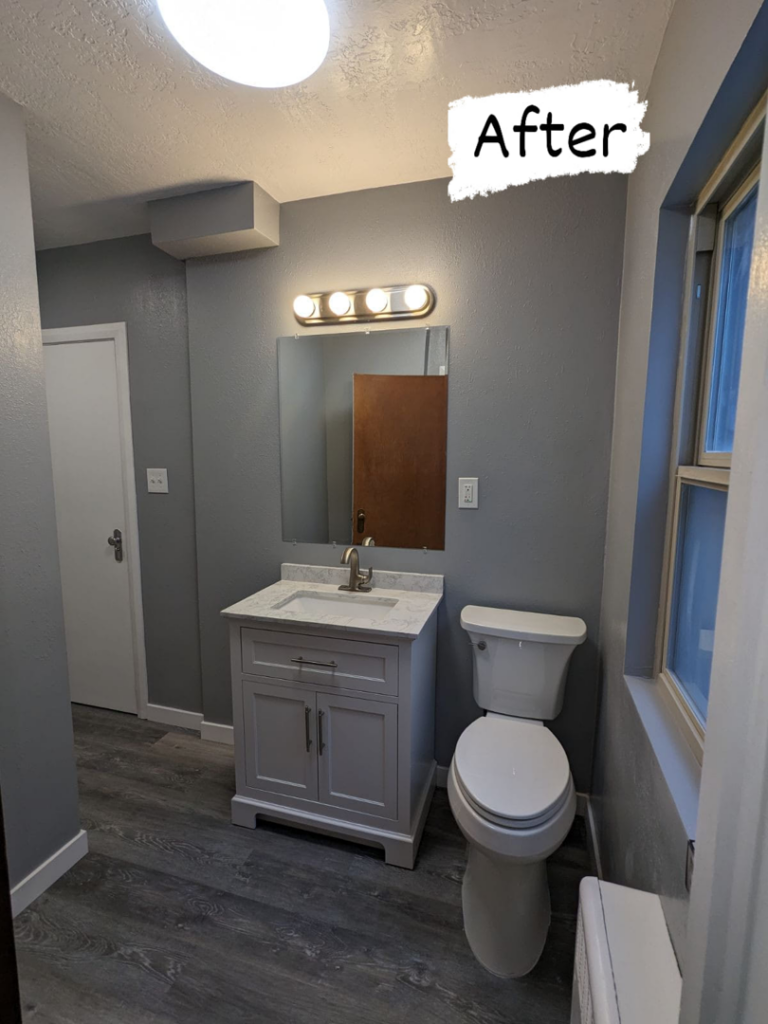 A beautifully remodeled bathroom featuring a new vanity, toilet, and updated flooring completed by Joel's Handyman in Ogden, UT.