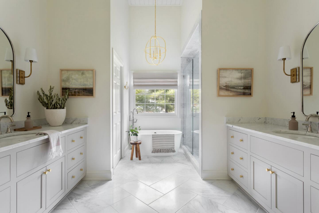 A beautifully renovated bathroom with new vanities and a freestanding tub by ADAMS Pro Finish in Spring Hill, TN.