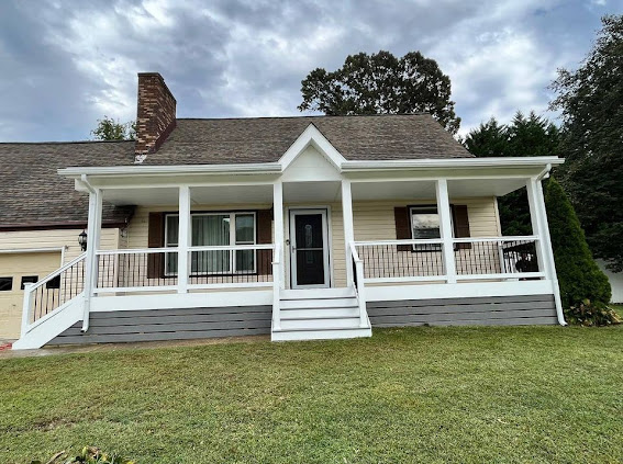 A beautifully renovated front porch with white railings on a house exterior by All Service Group LLC in San Jose, CA