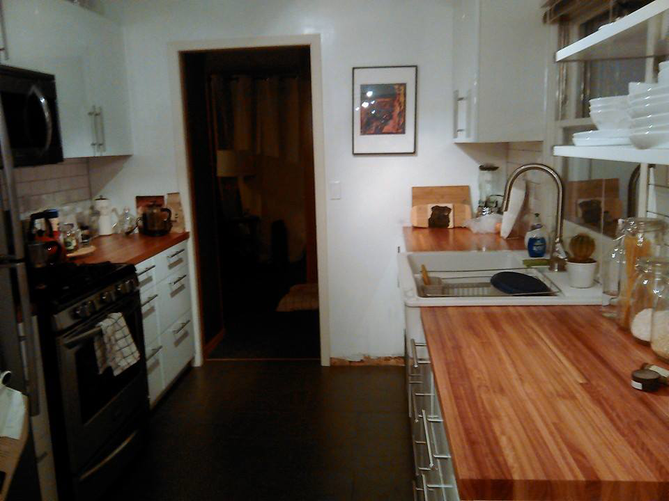 A full view of a renovated kitchen with new appliances and wooden countertops by Fine Hand LLC in Portland, OR