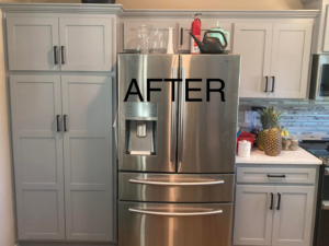 A renovated kitchen with new grey cabinets and stainless steel appliances by Anderson and Son Services in Olathe, KS