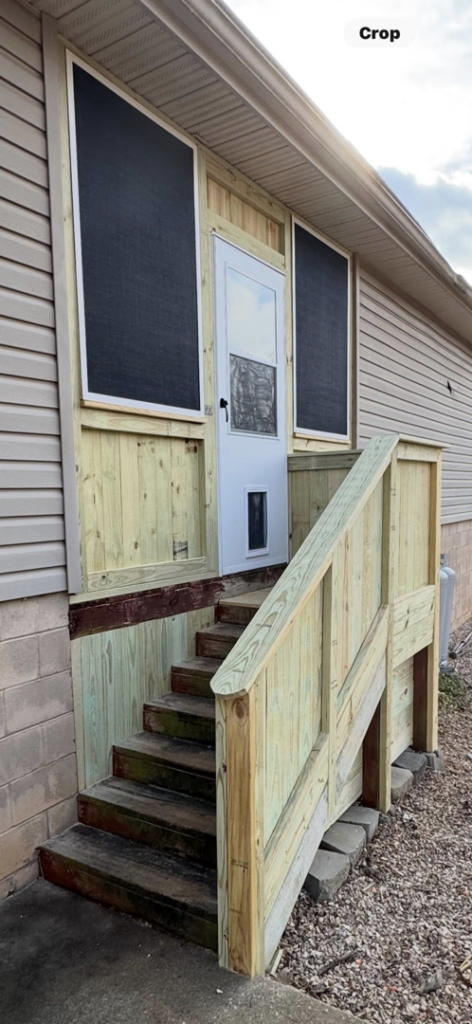A renovated wooden porch and entry stairs on a house, a project by Screw it, Call Rod in Rogers, AR.
