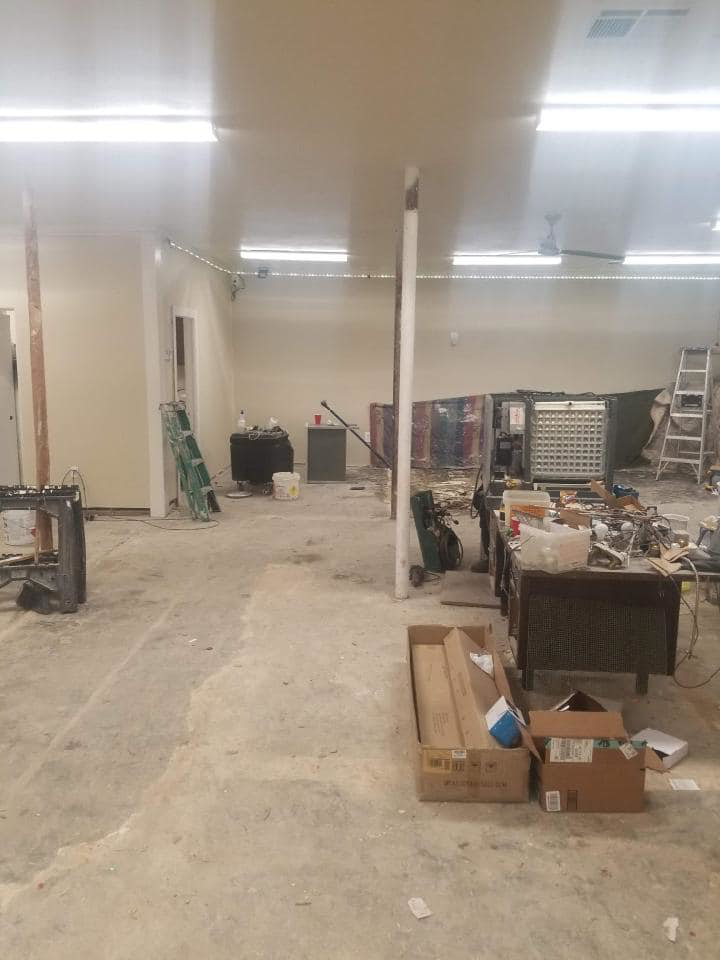 Renovation work in progress with tools and debris by United Contracting, LLC in Lexington, KY