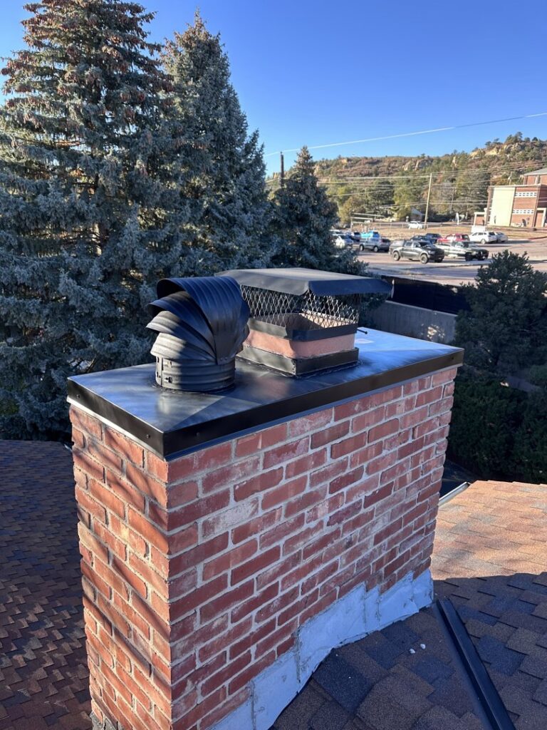 A newly repaired chimney with new flashing and cap installed by Premium Home Solutions LLC in Hickory Hills, IL
