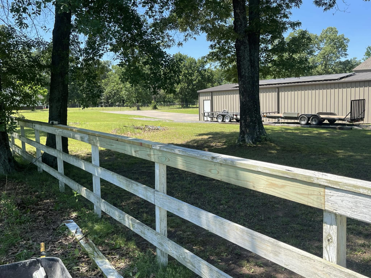 A section of a wooden fence showing new repairs by S&S Handyman Services in Reno, NV