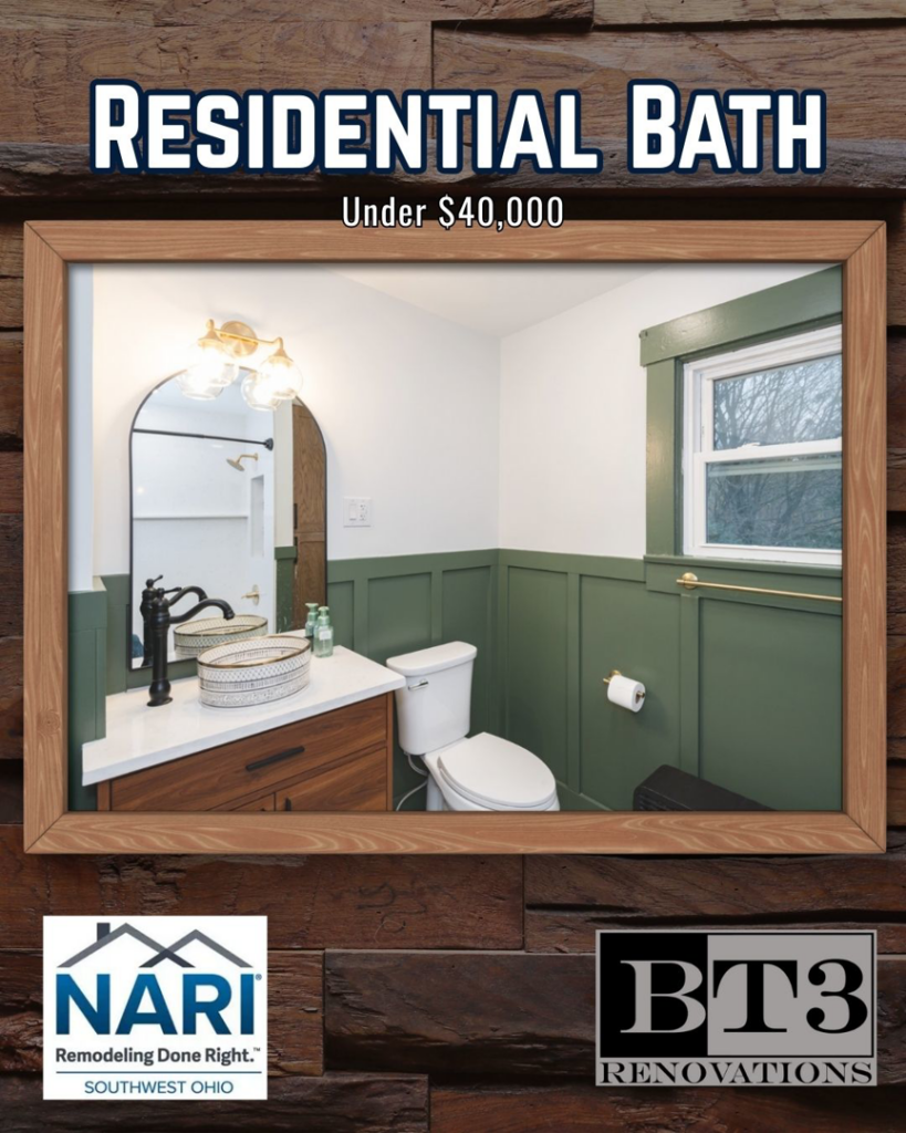 A beautifully remodeled residential bathroom with green wainscoting by BT3 Renovations in Dayton, OH.