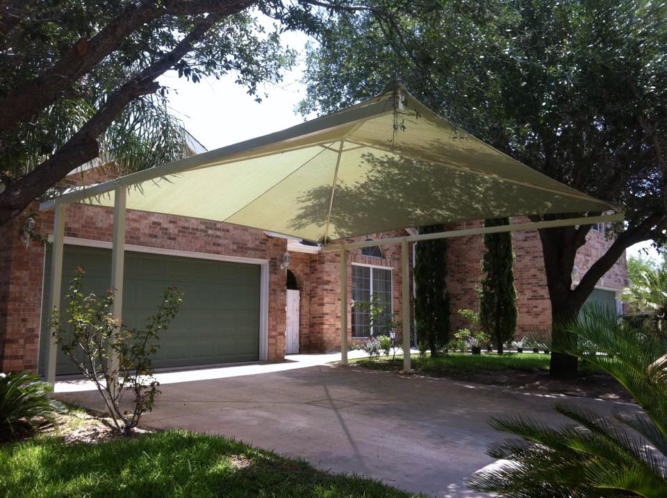 A newly installed residential carport shade structure by Laredo Shades, a general contractor in Laredo, TX.