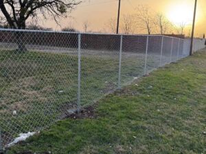 A durable residential chain link fence installed by Tin Star Fencing in Fort Worth, TX