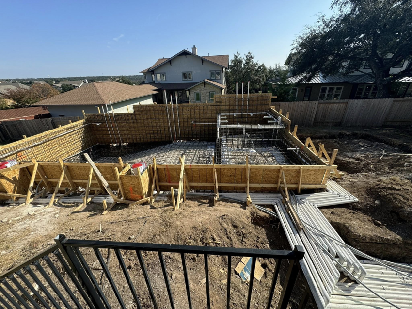 A residential construction site showing pool formwork and rebar by Stealth Civil Contracting in Austin, TX.