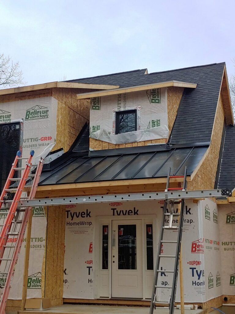 Residential construction with Tyvek wrap and partial metal roof installation by JB Home Improvement Services in Sanford, FL.