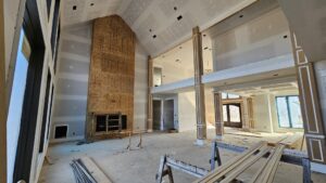 Interior of a residential home under construction, showing new drywall installation by Acosta Painting LLC in Jonesboro, AR.