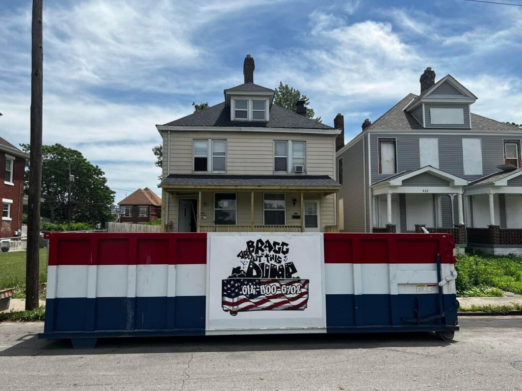 A Bragg About This Dump roll-off dumpster placed on a residential street for a cleanout in Columbus, OH.