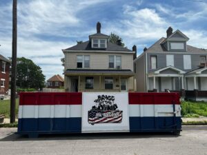 A Bragg About This Dump roll-off dumpster placed on a residential street for a cleanout in Columbus, OH.