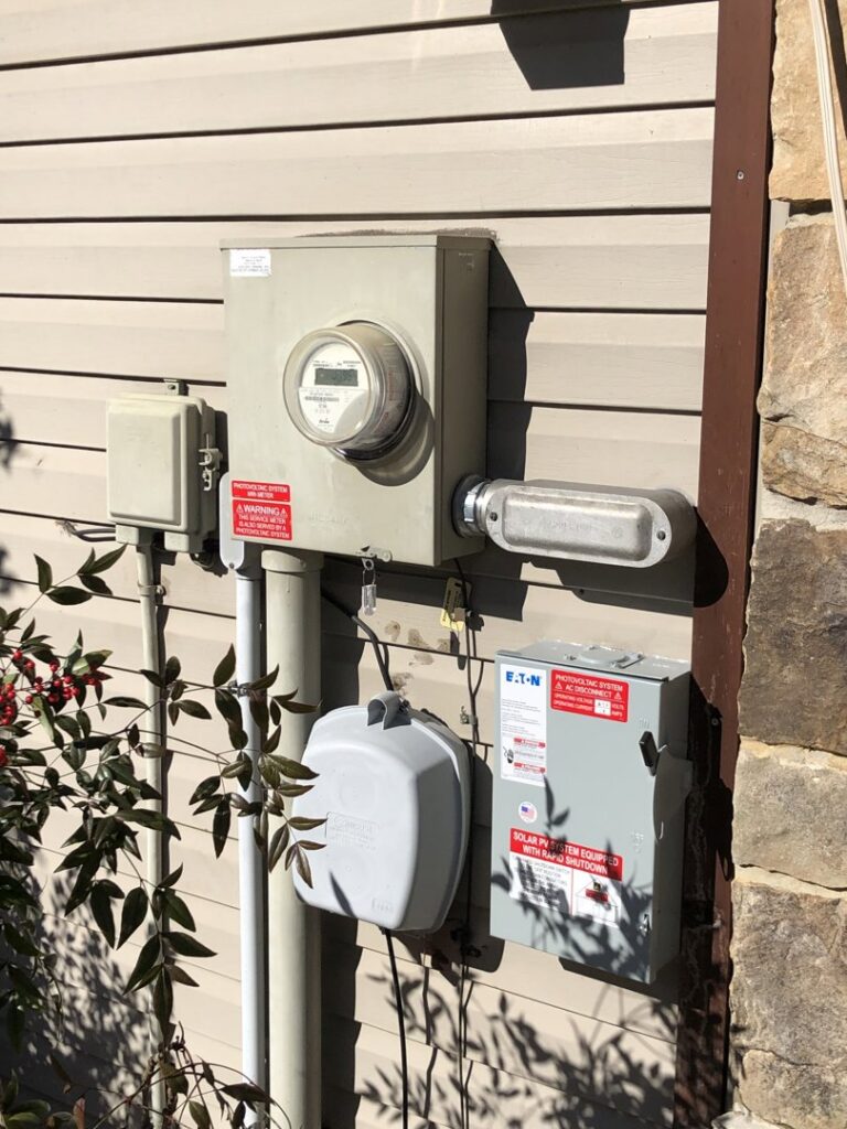 Exterior electrical meters and service panels installed on a building by Specialty Service Group in Knoxville, TN.