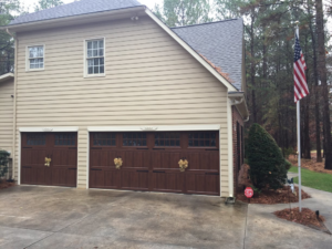 Residential garage door installation on a house by Harold Carpenter Overhead Door inc in Oshkosh, WI.