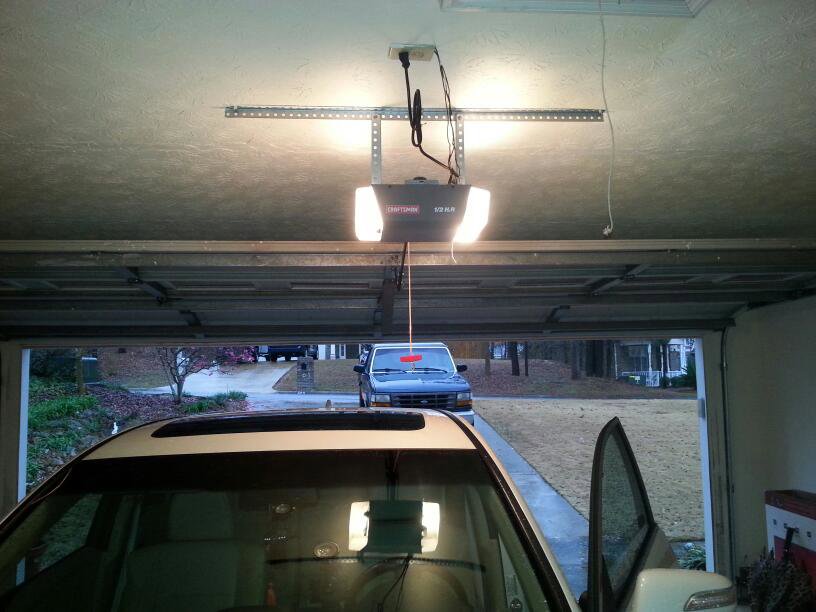 A newly installed residential garage door opener in a home garage by Overhead Door Company of Columbus in Columbus, GA.
