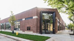 A newly renovated residential interior with light grey walls and a modern staircase by ETI Construction in Chicago, IL.