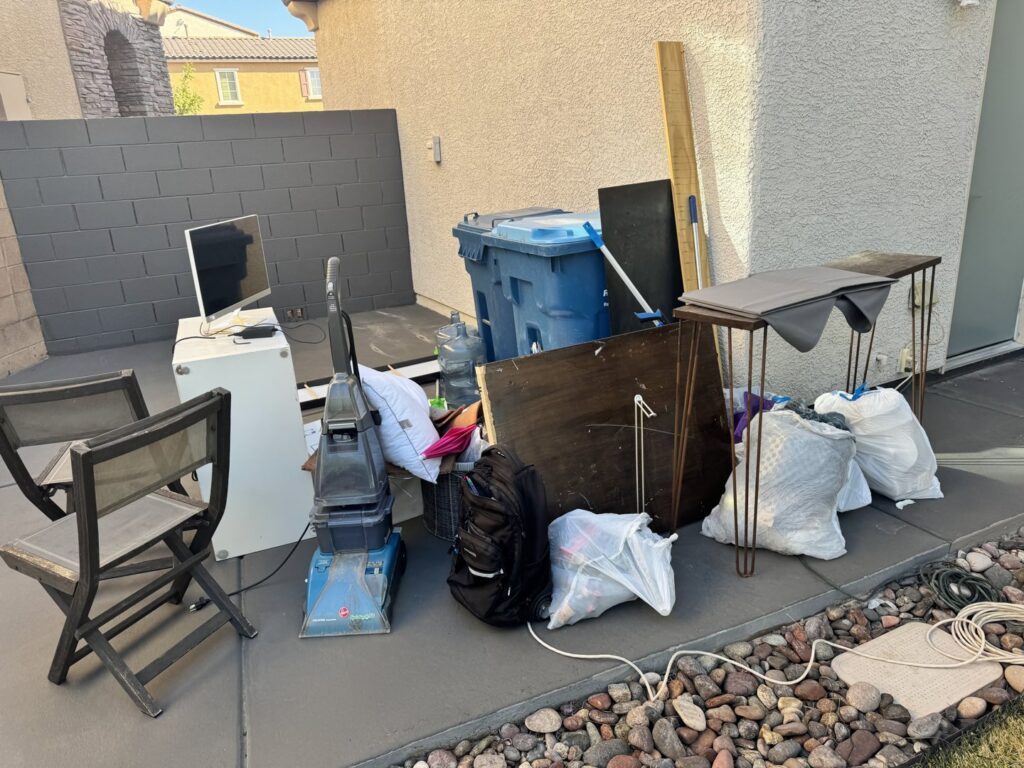 A pile of household junk, including furniture and electronics, ready for residential removal by Gone Junkin' Vegas in Henderson, NV.
