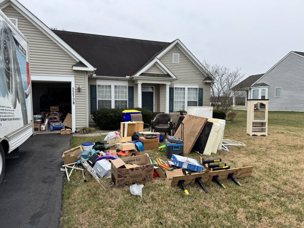 A large pile of residential junk and furniture on a driveway for removal by Insta Junk Removal & Demolition LLC in Salisbury, MD